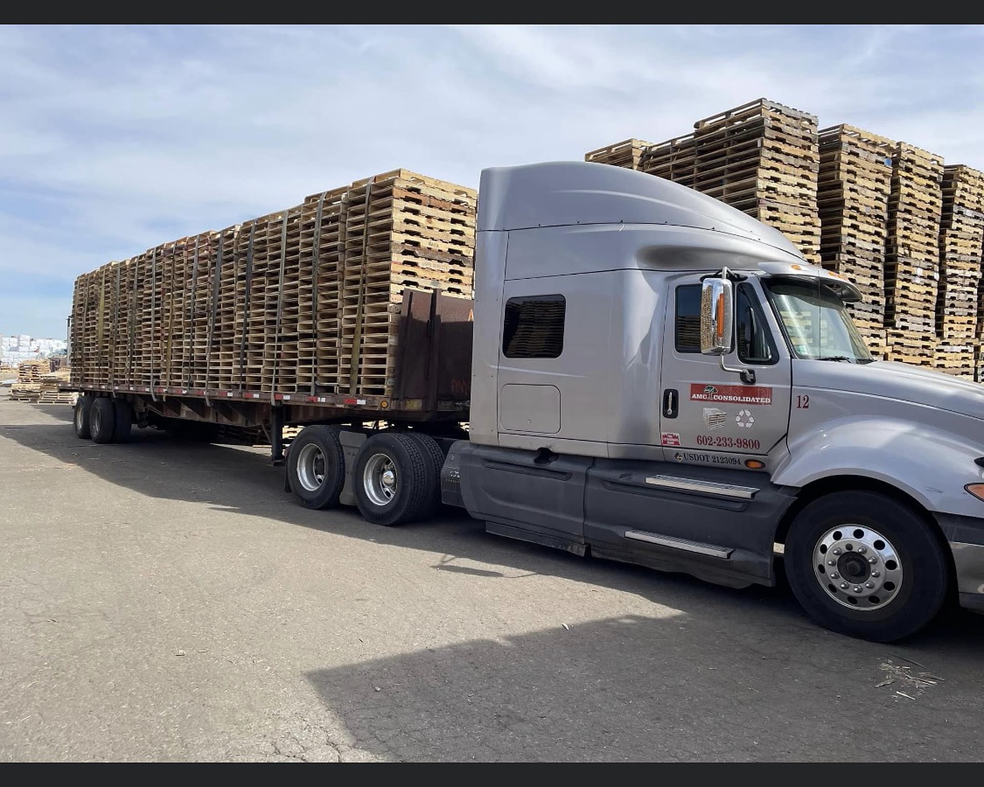 Delivery trucks loading pallets